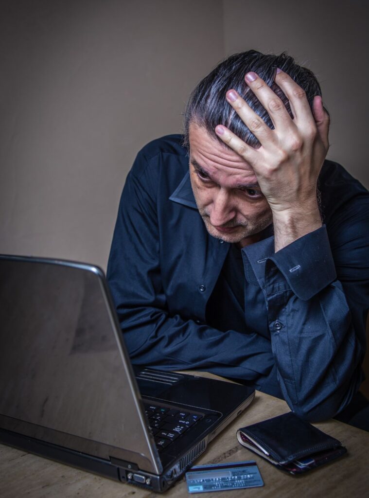 Worried man facing online fraud
